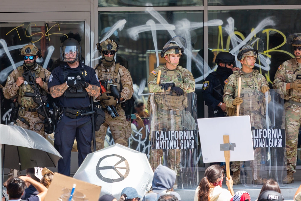California National Guard members assigned to Task Force 51 guard a federal buildin gin Los Angeles on June 9, 2025. DVIDS/Alexander Werden