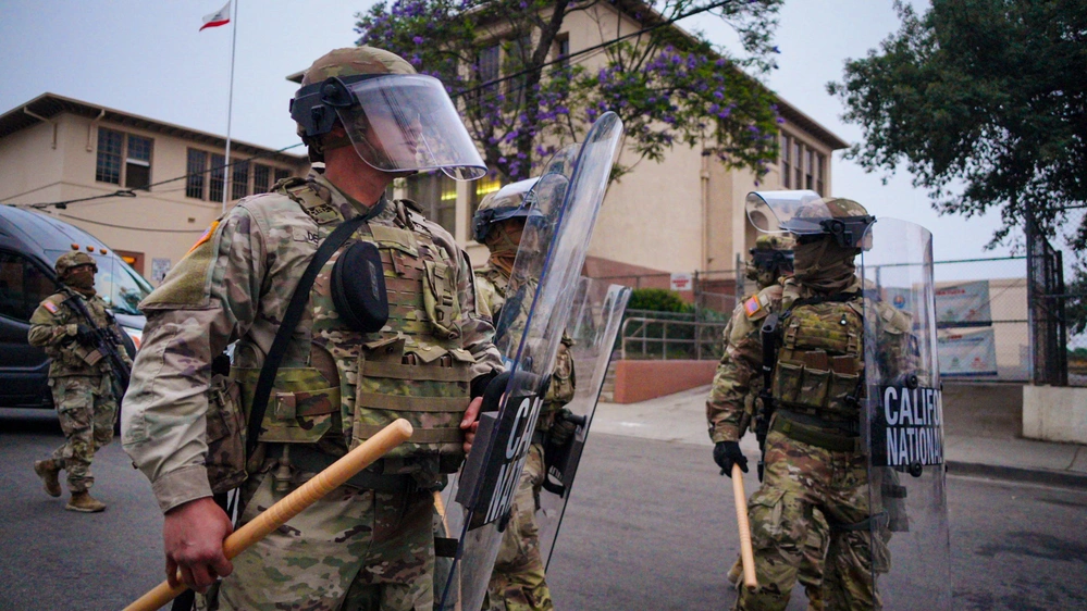 California National Guard members protect federal law enforcement during an operation in east Los Angeles on June 12, 2025. DVIDS/Chase Murray