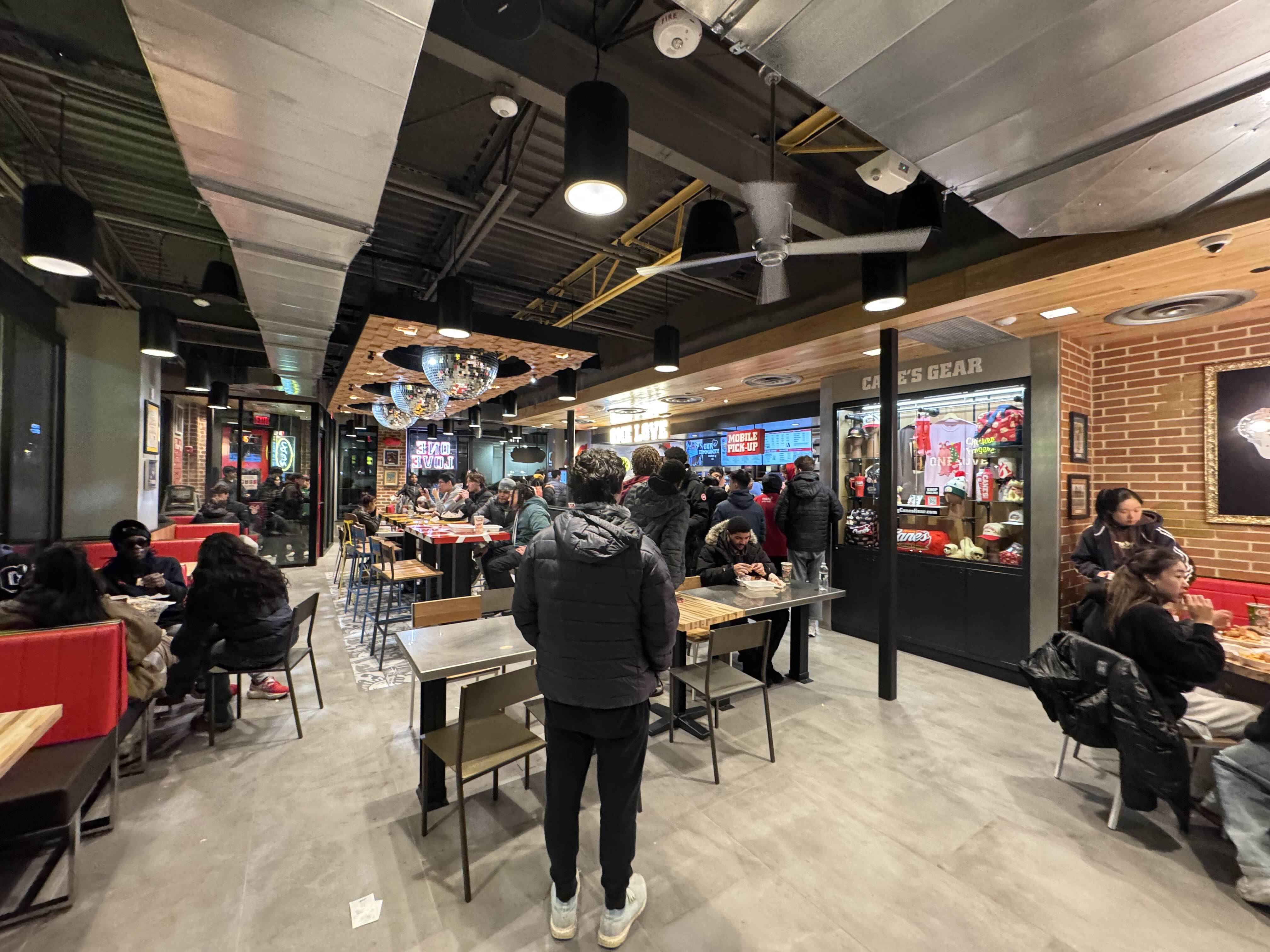 The interior of Raising Cane&rsquo;s in College Park midnight on opening day, Dec. 9, 2025. ZFJ/Alvin Wu